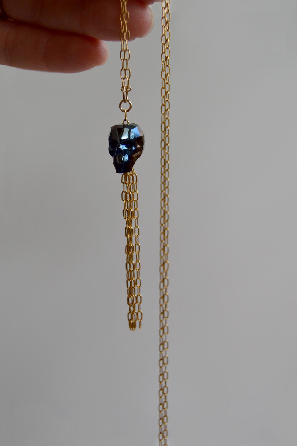 crystal skull necklace - gold deep sea